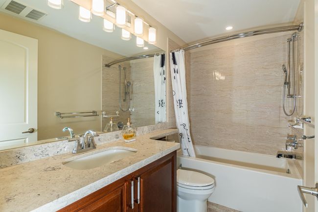 Full bathroom with vanity, shower / tub combo, toilet, and recessed lighting | Image 16