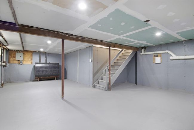 Unfinished basement with heating fuel and stairway | Image 32