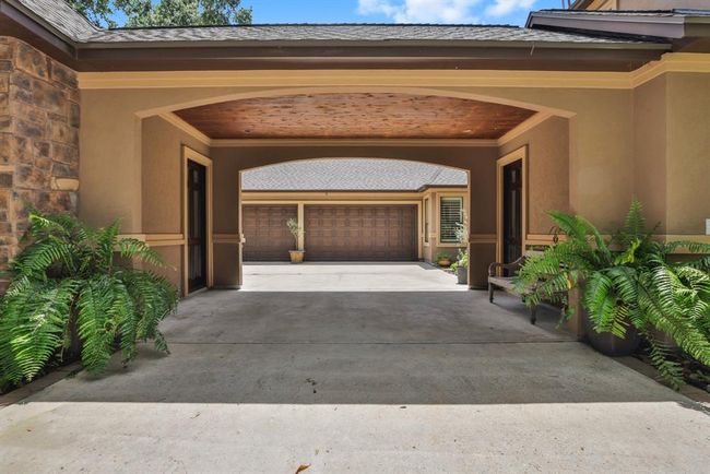 The door on the right is a friends entrance to the home. You don't have to go through the garage or front door and it's very convenient for visitors. The door on the left leads to a 156 SF room that would be perfect for a second home office, home gym, craft room, or home school room. This room is not included in the advertised SF of 5917 SF, but is an addition to that space. | Image 9