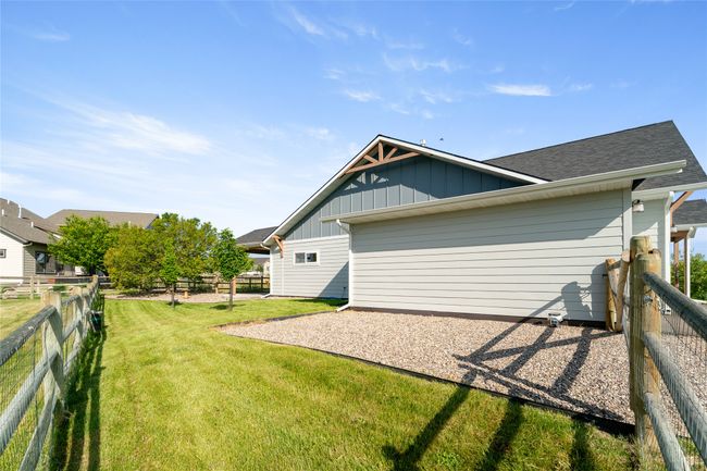View of side of home featuring board and batten siding and a shingled roof | Image 47