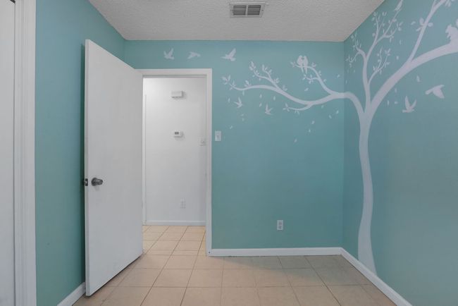 Second Bedroom featuring a hand painted scene | Image 23