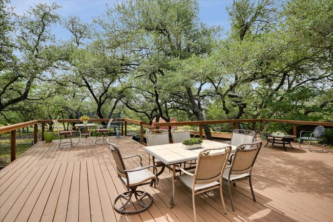 The spacious back deck offers the perfect spot to relax with a morning coffee or evening drink. | Image 24
