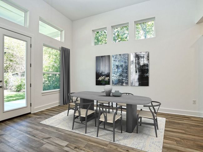 Dining space featuring plenty of natural light and dark wood-style flooring | Image 11