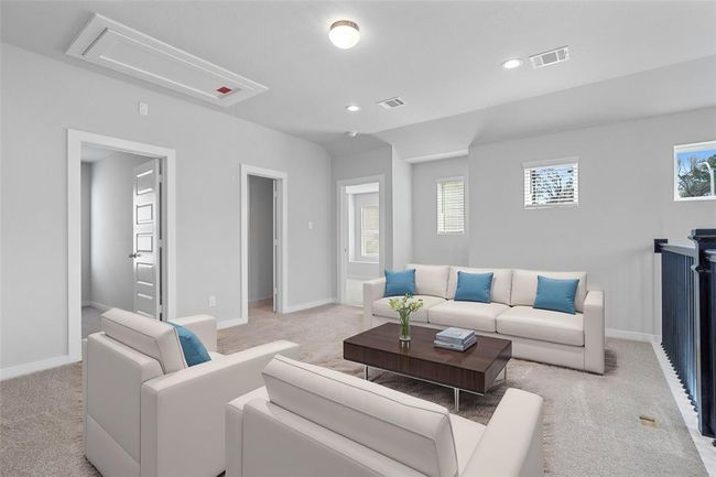 Come upstairs where the loft area features custom paint, high ceilings, recessed and flush mount lighting, and plush carpet flooring. | Image 7