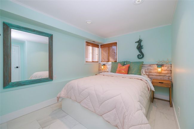 Bedroom with baseboards and ornamental molding | Image 9