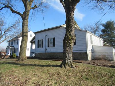 View of property exterior with a yard | Image 1