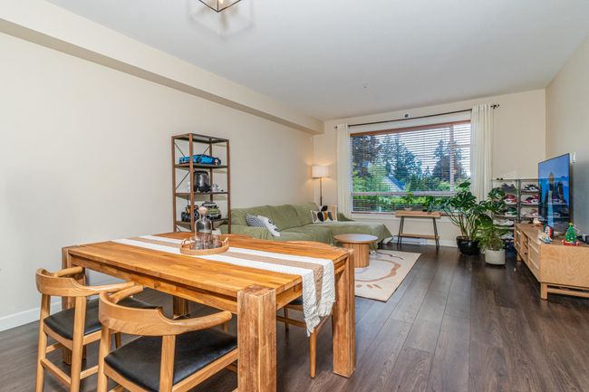 Dining space with wood finished floors and baseboards | Image 10