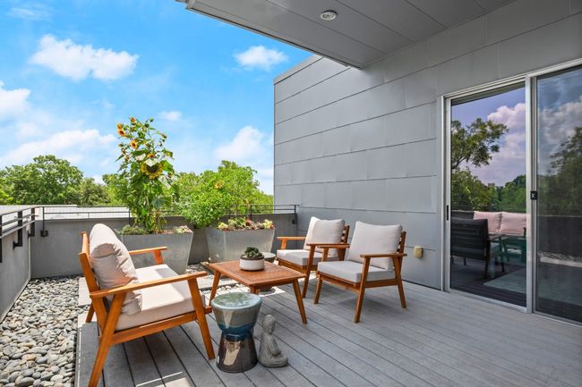 Second deck off of the primary bedroom- completely private from the rest of the home. This leads to the hidden deck and 3rd bedroom/office/gym. | Image 27