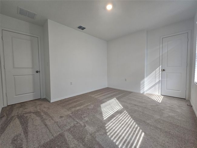 Unfurnished room featuring visible vents, baseboards, and carpet floors | Image 26