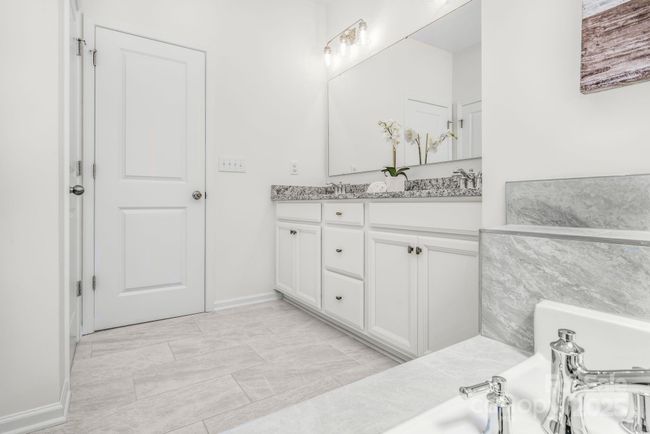 Primary bath vanities with adjacent linen closet | Image 24