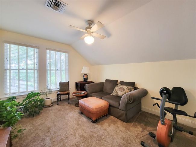 Unwind in the inviting upstairs living room, perfect for relaxation. | Image 22