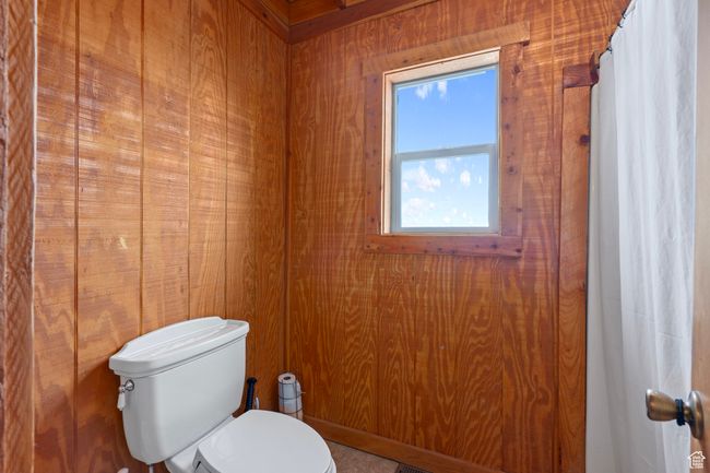 Bathroom with tile patterned floors and toilet | Image 17