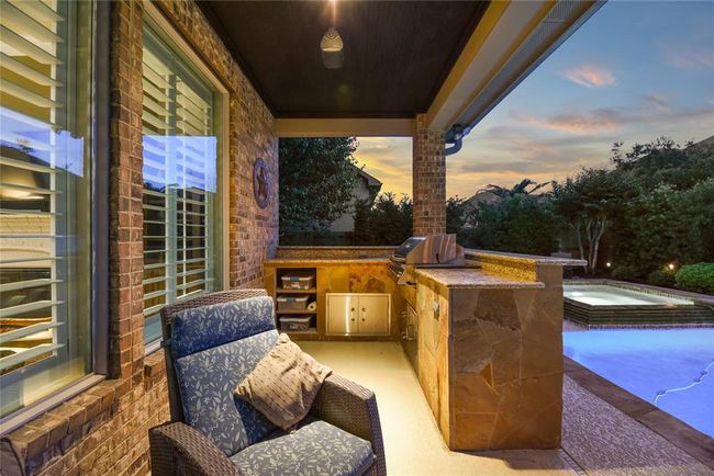 Covered patio with outdoor kitchen. | Image 35