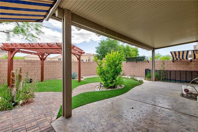 View of patio / terrace featuring a fenced backyard and a pergola | Image 4