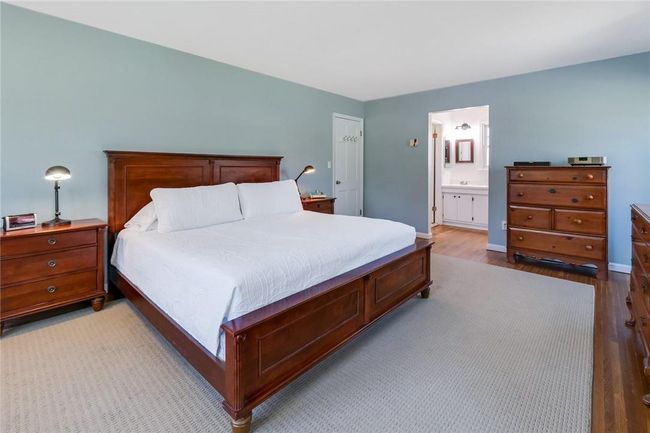 Primary bedroom with ensuite bathroom and walk in closet. | Image 19