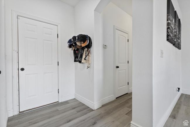 Entrance foyer with light hardwood / wood-style floors | Image 14