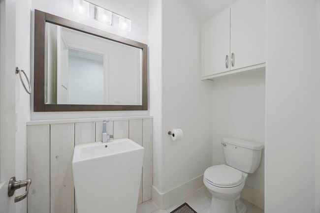Half bath with tile patterned flooring and toilet | Image 23