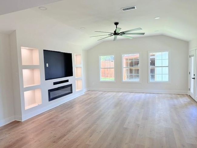 Beautiful Custom Built Entertainment Center with electric fireplace, controller for multicolor lights and space for a large tv. | Image 10