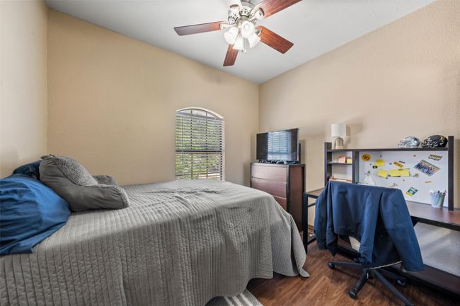 Bedroom featuring wood finished floors and a ceiling fan | Image 14