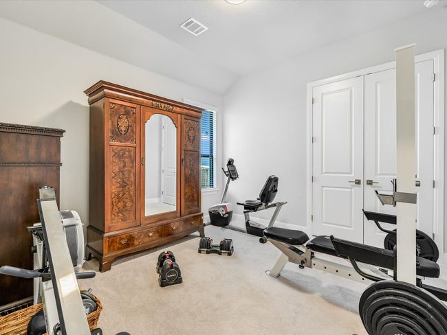 Exercise area featuring vaulted ceiling and carpet | Image 28