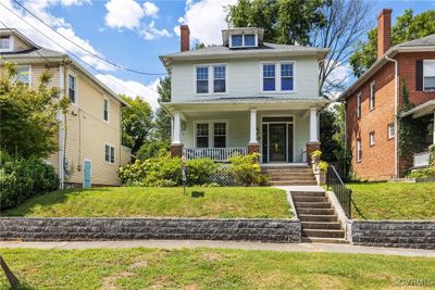 View of front facade featuring a front yard and covered porch | Image 1