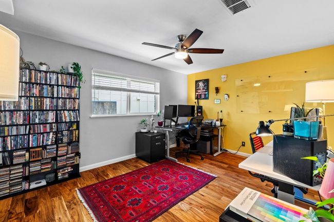 Currently used as an office for a busy creative, the primary bedroom is large in size, including an en suite bathroom. | Image 34