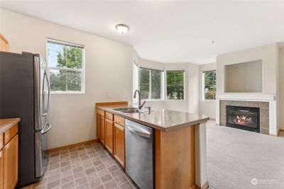 View from Kitchen to family room. You can see the park from the kitchen and family Rm windows | Image 3