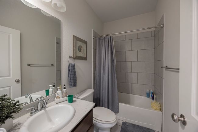 Bathroom with vanity and shower / bath combo with shower curtain | Image 21