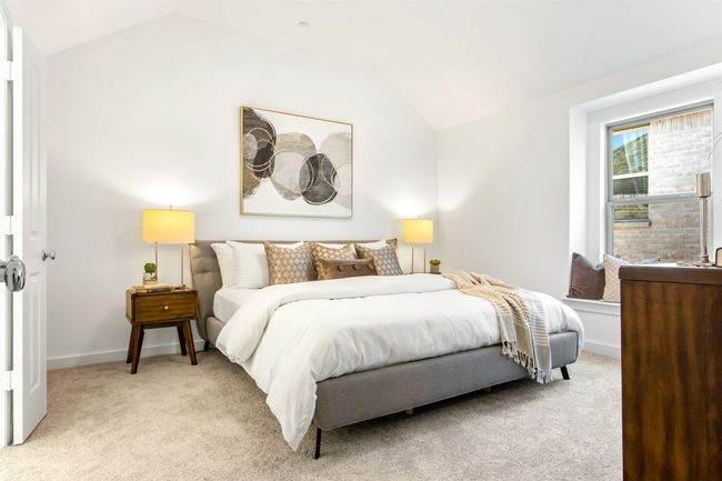 Bedroom featuring lofted ceiling and light carpet | Image 25