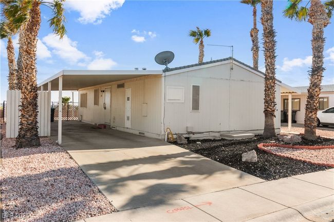 Front view of property with driveway and an attached carport | Image 28