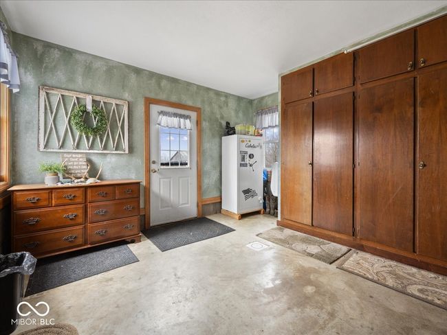 Side entry mudroom with built in cabinets for coats, shoes, and gear. | Image 24