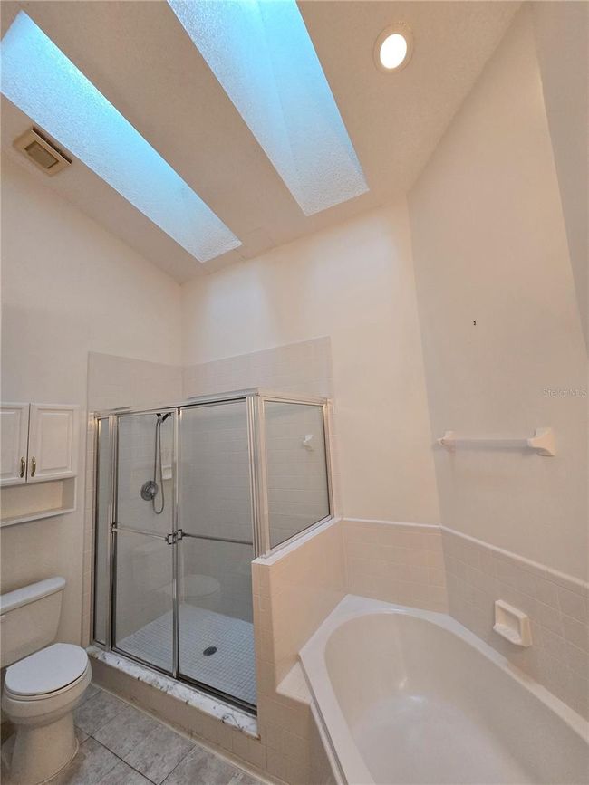 Another view of master bathroom showing skylights | Image 26