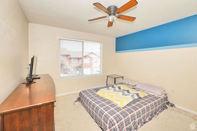 Carpeted bedroom featuring baseboards and a ceiling fan | Image 26