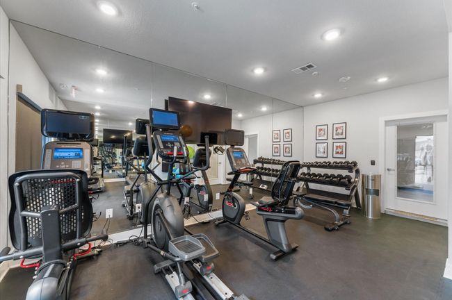 State-of-the-art fitness center equipped with cardio machines, free weights, and strength training equipment. | Image 22