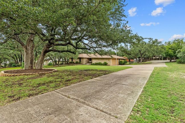 View of side of home with concrete driveway and a lawn | Image 35