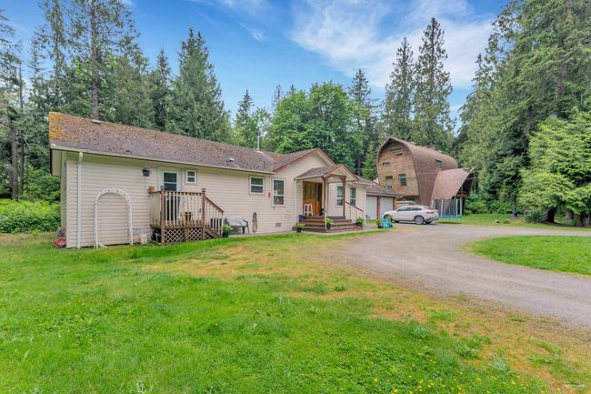 View of front of house featuring a front lawn and driveway | Image 5