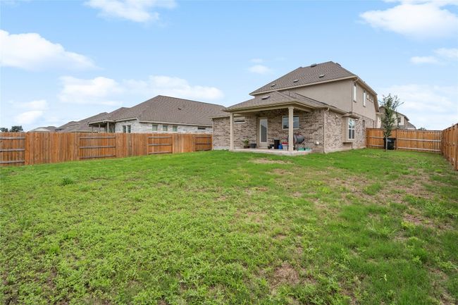 Back of house featuring a patio and brick siding | Image 34