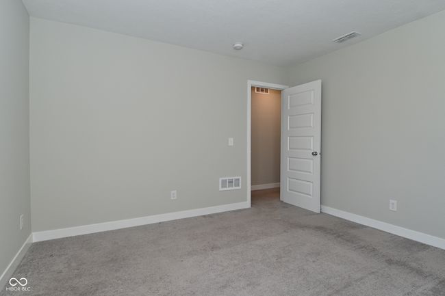 carpeted empty room with visible vents and baseboards | Image 32