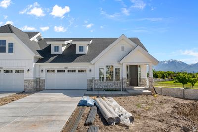 View of front of home with a garage and a mountain view | Image 1