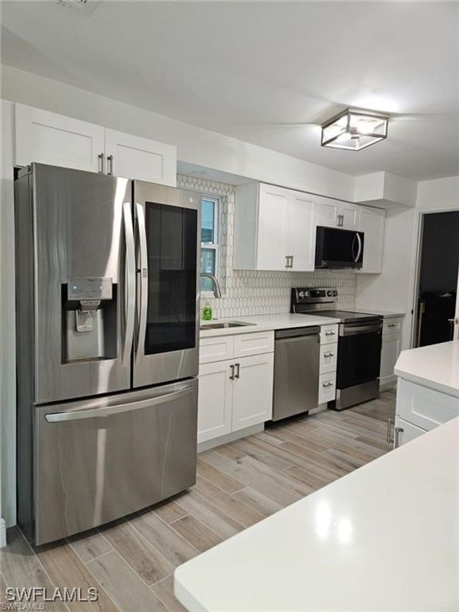 1322 Farmdale St, House other with 3 bedrooms, 2 bathrooms and null parking in LEHIGH ACRES FL | Image 4