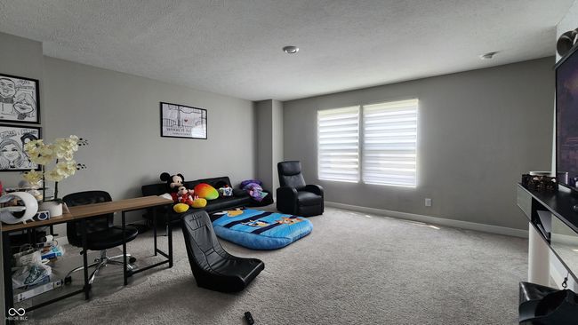 home office with carpet flooring and a textured ceiling | Image 13