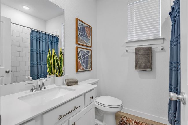 Full bath featuring vanity and a shower with shower curtain | Image 6