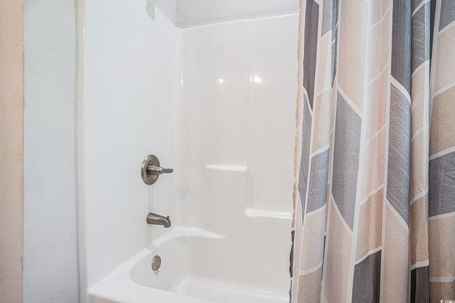Full bathroom featuring shower / tub combo | Image 20