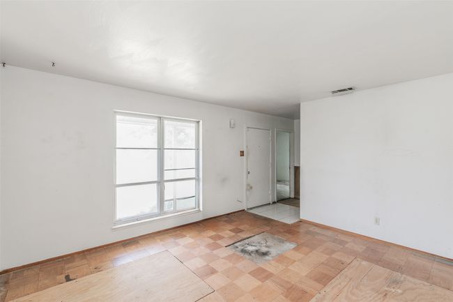Spare room with baseboards | Image 13