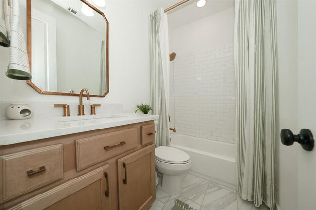 Elegant third full bathroom with modern fixtures and chic design. | Image 31