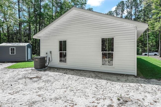 Back of property with cooling unit | Image 25