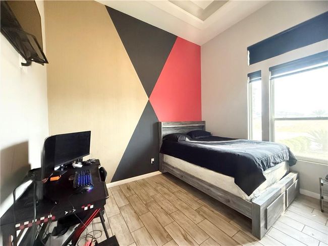 Bedroom featuring wood tiled floors and baseboards | Image 14