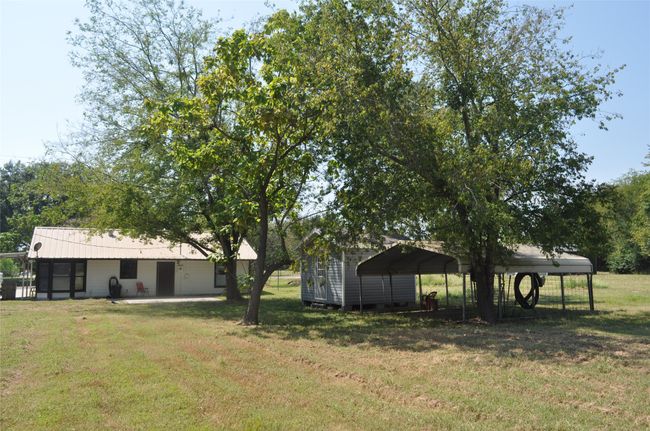 View of yard with a carport | Image 16