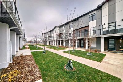 8235 8 Ave Sw, Townhouse with 2 bedrooms, 3 bathrooms and 2 parking in Calgary AB | Image 1