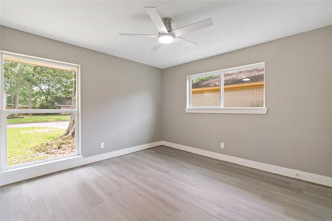 4th bedroom (suite) with plenty of windows (natural lighting). | Image 16
